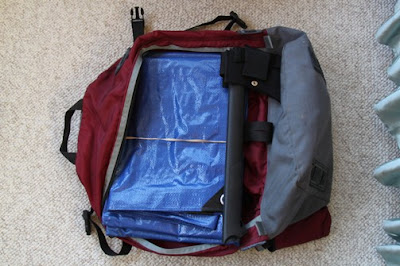 Our main survival gear goes into a medium size knapsack with a 10 x 12 blue tarp. Blue is easy to see as a visual signal. These are cheap from Wal-Mart, red would also work.