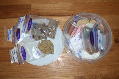 All the spices, sugar, and other granular food items go into breast milk bags. They double seal, have a place to write what is in the bag and are sterilized out of the box. The round container fits perfectly into the pail.