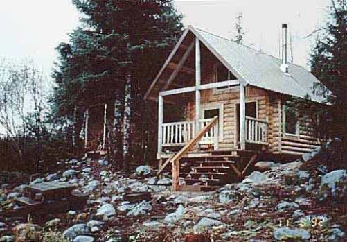 Eagle Glacier Memorial cabin and picnic table in rocky terrain